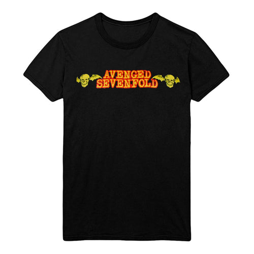 Black tee on a white background. Chest print has gold with red border text that reads Avenged Sevenfold in between two black & gold skulls with bat wings.