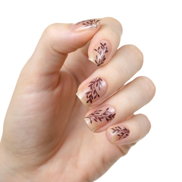 Beloved sheer nude nail polish with brown leaf accent nail art