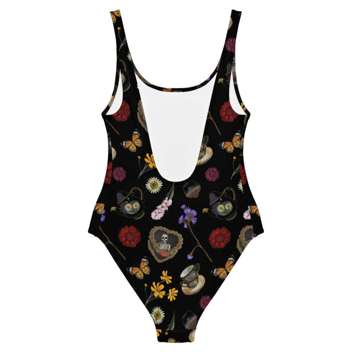 Gothic Tea Time one-piece swimsuit in black with pale butterflies and pink snapdragons, kawaii goth style