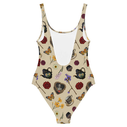 Gothic Tea Time one-piece swimsuit in black with a heart-wreathed skeleton and black teapots, goth fashion
