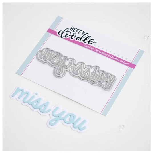 Heffy Doodle - Heffy Cuts Die - Miss You. A metal cutting die of the words 'Miss You’ in a script font style, in addition to a matching outline die to create a shadow matt layer. Use together or separately to create different looks for your projects. Measuring approximately 3.5"x1.25". Available at Embellish Away located in Bowmanville Ontario Canada.