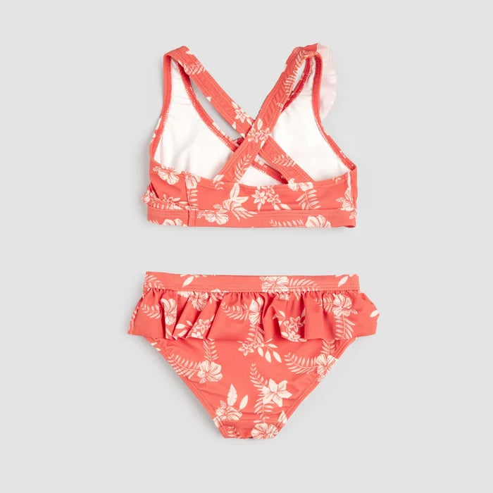 Front view of Petit Lem raspberry hibiscus cross-over bikini set laid flat.