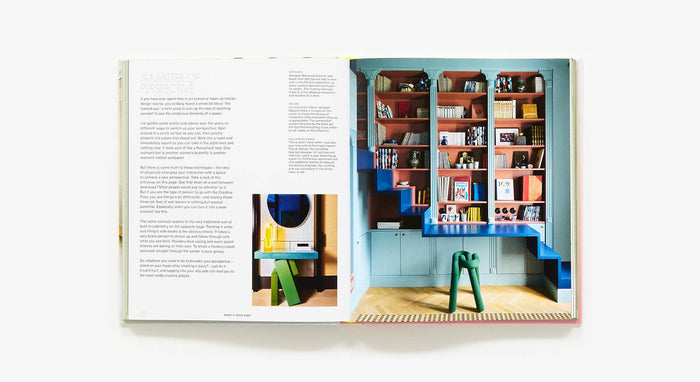 Open book showing a colorful interior design with shelves and furniture.