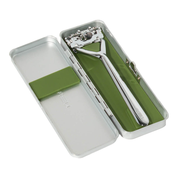 Leaf Razor in a silver travel case on a white background