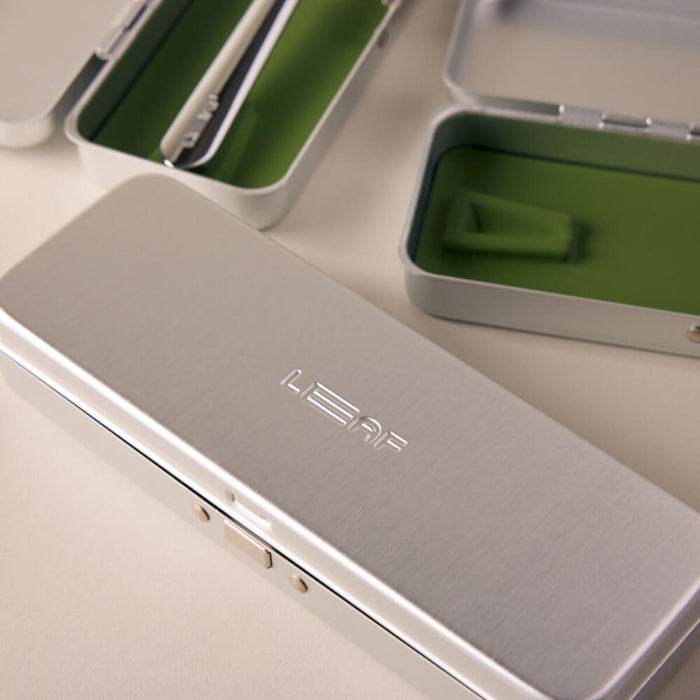 Silver Leaf Razor travel case with 'LEAF' branding on a light background