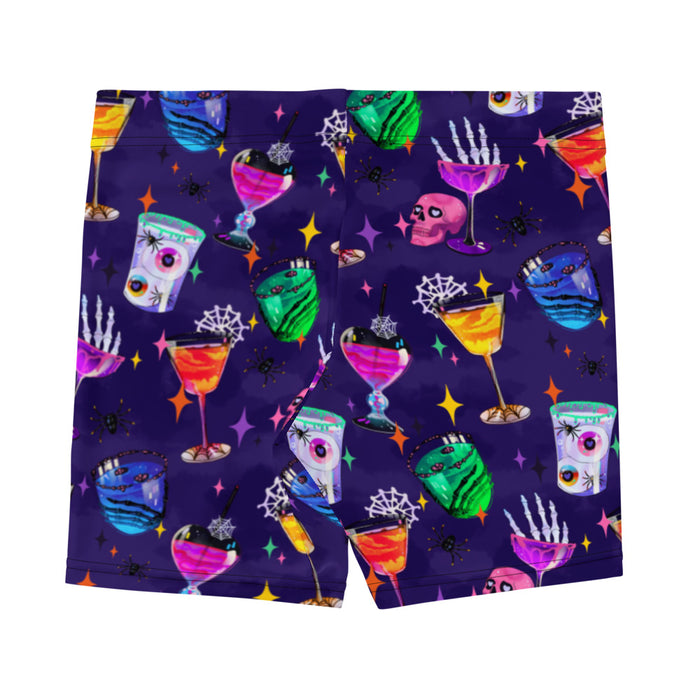 Monster Party gothic shorts, back view, with slime-rimmed eyeball drinks and heart-eyed skulls in jewel tones