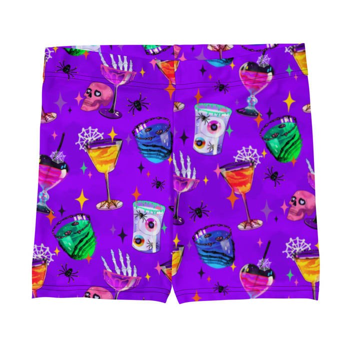 Monster Party gothic shorts, front view, with cobweb-laced cocktail glasses and pink skulls in jewel tones
