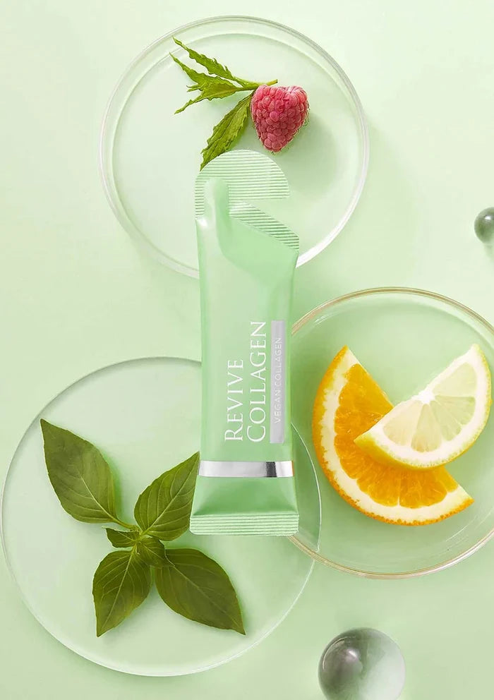 Revive Collagen product on a green background with leaves and fruit