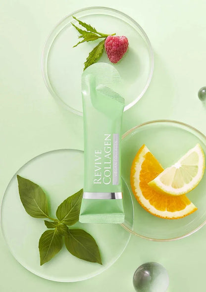 Revive Collagen product on a green background with leaves and fruit