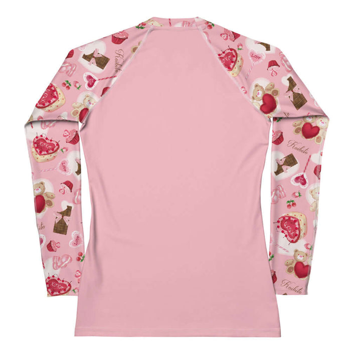 Sugar Sweetheart kawaii rash guard in pastel pink with strawberries and frosted cupcakes