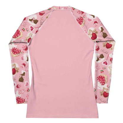 Sugar Sweetheart kawaii rash guard in pastel pink with strawberries and frosted cupcakes